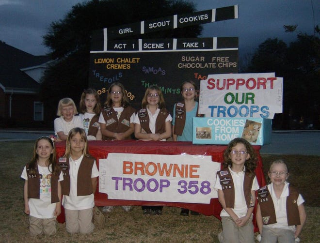 The girls of Brownie Troop 358 of Rincon are pictured with their cookie booth. The theme for this year's cookie sale is "Make It a Hit." Effingham Girl Scouts began selling cookies Saturday. Troops also will be selling cookies that will be sent to our soldiers serving overseas.