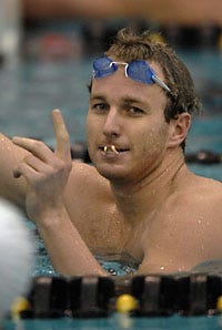 Aaron Peirsol acknowledges his victory in yesterday's 100-meter backstroke final at the Missouri Grand Prix swim meet at the Mizzou Aquatics Center.