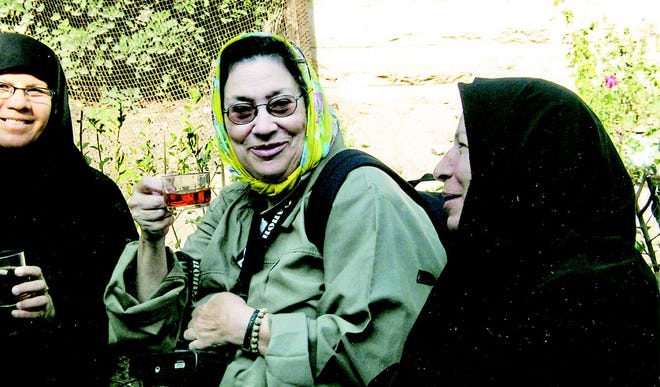 Pittsford resident Lynda Howland, center, shares a cup of tea with two Iranian women in Syria last fall. Howland left this week to travel to Iran, where she’s meeting with citizens and dignitaries while she takes part in a civilian delegate trip with other Americans.