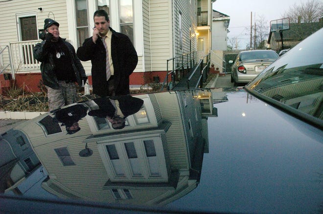 Brockton police officers investigate a fatal shooting Tuesday afternoon outside 10 Essex St.
