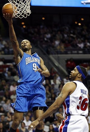 Orlando Magic forward Rashard Lewis (9) drives to the basket as Detroit Pistons center Rasheed Wallace (36) guards him during the first half of an NBA basketball game at the Palace of Auburn Hills in Auburn Hills, Mich., Tuesday, Feb. 19, 2008.