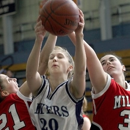 Framingham's Ashley Donaghey pulls down a rebound between Milford's Alex Murray (left) and Meg Chamberlin.