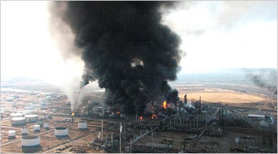 Plumes of smoke rise after an explosion at an Alon USA oil refinery in Big Spring, Texas on Monday, Feb. 18, 2008. The violent blast shook buildings miles away and injured at least four people, the mayor said.