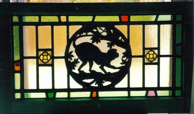 The monkey silhouette in the leaded glass window greatly adds to the value.