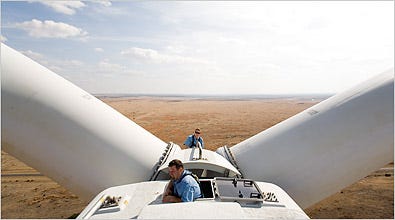 Jim Albert, front, and Jerry Tuttle, General Electric wind technicians, perch atop a turbine in Sweetwater, Tex. The turbines stand as high as 20-story buildings.