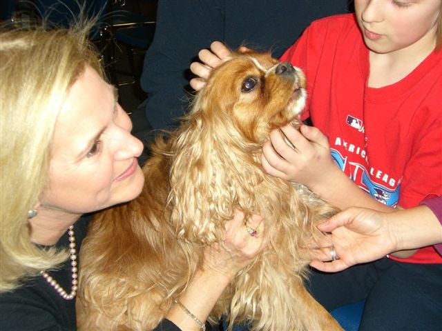 Tuffy, a Cavalier King Charles spaniel, and owner Karla Rose help people cope with grief.