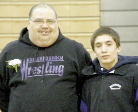 Senior wrestler Roberto Rivera with his uncle Roberto Vargus. Over the weekend Rivera won the Championship match at 112 for Wallenpaupack’s first ever Gold medal in wrestling.