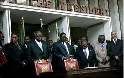 Standing behind chairs, President Mwai Kibaki of Kenya, left, and Raila Odinga prepared to sign a deal on Thursday in Nairobi.