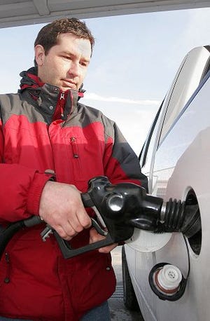 Aaron Leclerc/Staff photographer 
Kevin McNally of South Berwick, Maine, said he feels the pressure of increased energy costs, paying $80 weekly to fill the gas tank on his Ford F-150 truck.