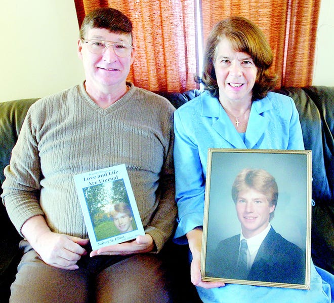 John and Nancy Elliot of Penfield show a photo of their son David, who died 20 years ago in a skiing accident. Nancy and John wrote a book about him, called “David’s Message: Love and Life Are Eternal.”