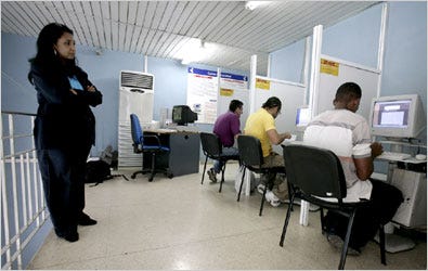 At an e-mail center in Havana, customers work under an employee’s watchful eye. Old Havana has only one true Internet cafe, down from three a few years ago.