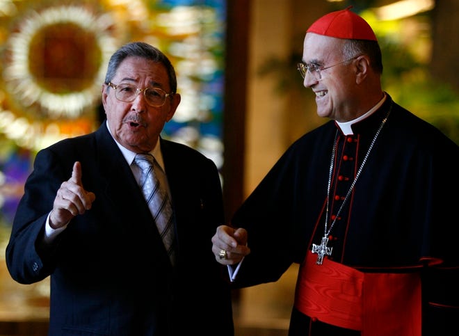 Cuba's President Raul Castro, left, talks to Cardinal Tarcisio Bertone, the Vatican's Secretary of State, at the Revolution Palace in Havana. Raul Castro met behind closed doors with Cardinal Bertone in his first encounter with a foreign dignitary as Cuba's president.