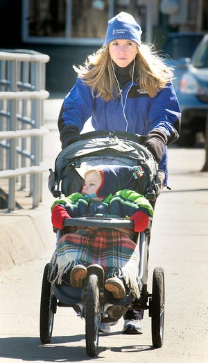 The sunny weather on Tuesday had people outdoors despite the cold. Among them were Cheryl O’Malley and her son Jake, 2½, who were out for a stroll around Scituate Harbor.