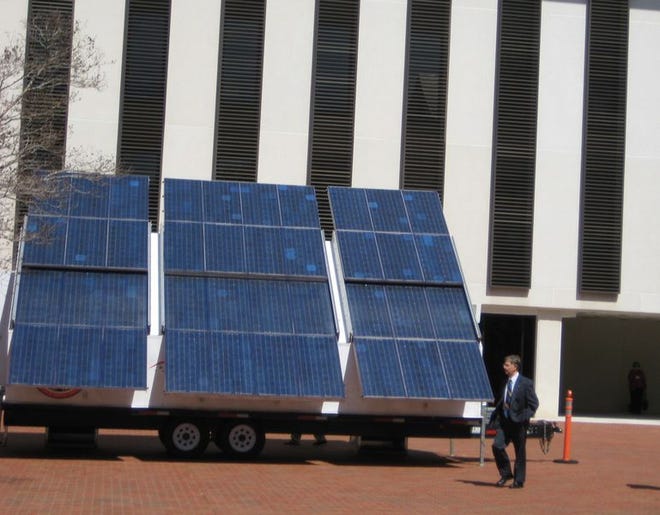 Large solar panels are displayed outside the state Capitol building Thursday. Solar advocates presented lawmakers Thursday with the results of a poll that showed the majority of Floridians support legislative policies that encourage solar energy, even if they have to pay more on their utility bills.