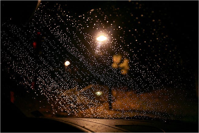 INTO THE NIGHT Raindrops on Barbara Berney’s windshield don’t make the trip home any easier. She says her night vision has worsened since Lasik surgery.