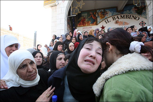 Sana Balboul, center, the wife of Ahmed Balboul, who was killed in an Israeli raid, at his funeral on Thursday in Bethlehem.