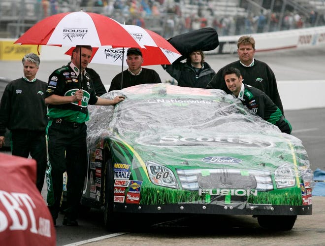 Wade Payne/The Associated PressThe crew of Carl Edwards pushes his car into the pits during a rain delay Saturday at Bristol Motor Speedway in Bristol, Tenn. Clint Bowyer won the NASCAR Nationwide Series Sharpie Mini 300 on Saturday afternoon.