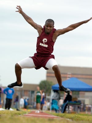 Riverview High's Ladarius Standifer flies through the air in the long jump at the Booker Invitational track and field meet Friday.