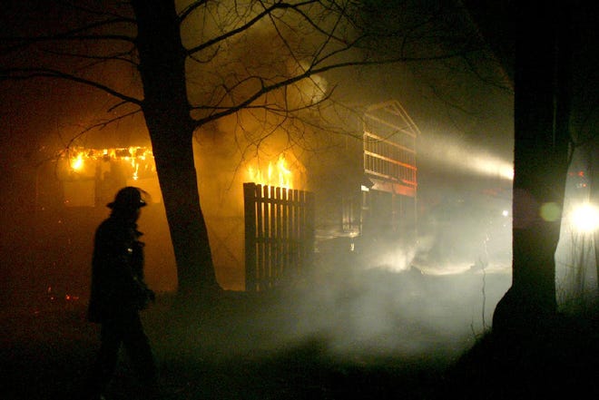 Firefighters work at the scene of a garage fire at 260 Braeside Ave. in East Stroudsburg on Saturday, March 15, 2008, at around 11:30 p.m. According to Acme Hose Company Fire Chief Bill Miller, the garage contained a vehicle and assorted lawn equipment. He also said that the State Police Fire Marshall would be investigating the fire. Another garage, only a few feet from this structure, was destroyed by fire six months ago. Fire crews worked at the scene into Sunday morning. No injuries were reported.