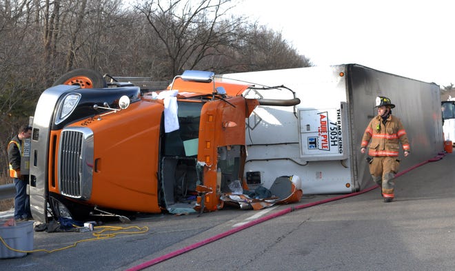 The driver of this 18-wheeler was trapped for nearly an hour then transported to UMass Medical Center after rolling over on the eastbound lane of the Massachusetts Turnpike Tuesday morning at 6:47 a.m. in Hopkinton.
