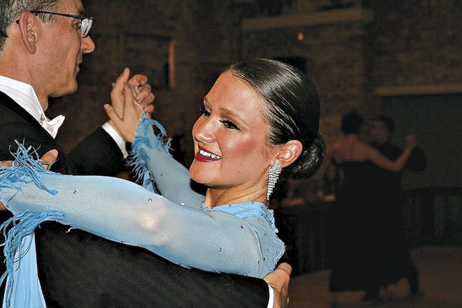 Carolyn Reed dances with her partner during a recent competition at Maria Alvarez Imperial Dance Studio. Ballroom dancing, which is gaining in popularity thanks to popular telelvision show's like ABC's "Dancing with the Stars," provides an excellent workout.
