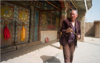 A groundskeeper in Qinghai Province leaving a temple after locking up. Many Tibetans say China is destroying their culture.