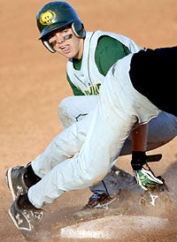 Rock Bridge's Darren Lasley slides safely into third base before scoring on a wild throw in the third inning of the Bruins' 11-4 season-opening victory over Smith-Cotton yesterday.