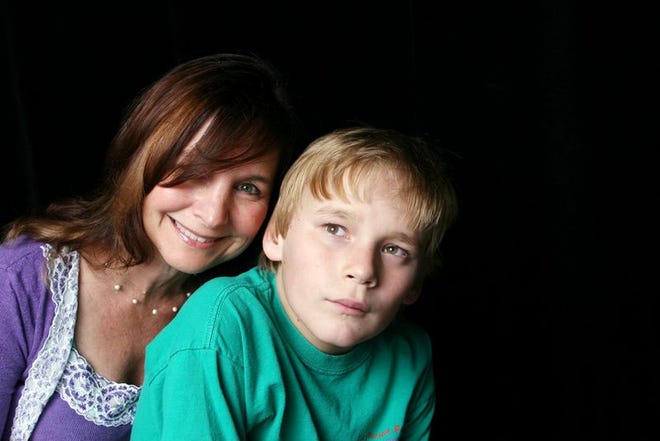 In this image released by HBO, Elaine Hall, a hyphenate educator-writer-performer-acting coach and founder of The Miracle Project, is shown with her autistic son Neal Katz. The pair are featured in a HBO film "Autism: The Musical."