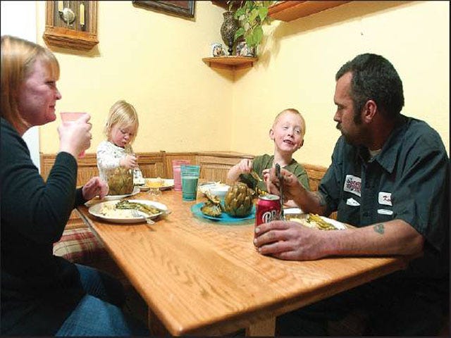 The Lancaster family enjoys eating dinner together at their home in Victorville. Studies have shown that sitting down to dinner as a family benefits children by teaching them better eating habits.