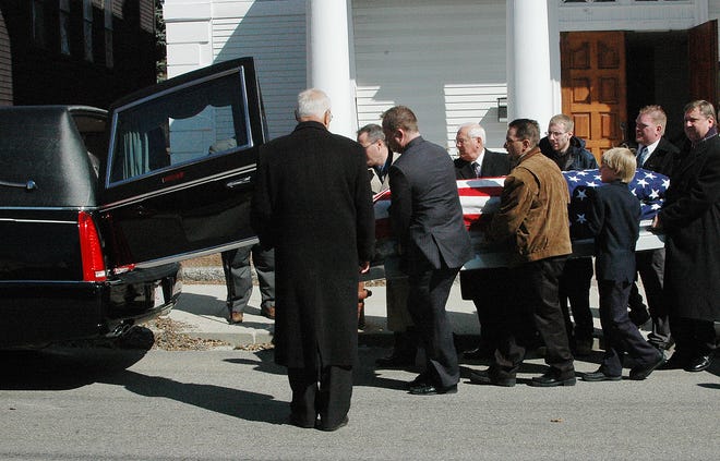 Anthony Brenna's casket is carried out of Pine Street Baptist Church in Milford on Friday by bearers Arthur Richards, Ernest Horwe, Anthony Brenna Jr., Kris Brenna, Gregory Orf, Joseph Bouthillor, Richard Baer and Kevin Meehaw.