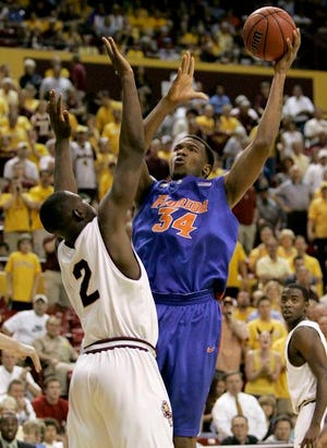 Florida center Marreese Speights shoots over Arizona State center Eric Boateng Tuesday night in Tempe, Ariz.