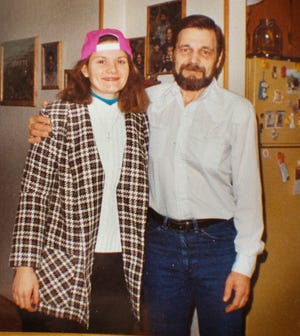 Family of Eric Peter Jacobsen, who was lost in an Alaskan fishing accident gather in the Hingham home of his daughter, Karen Jacobsen. A photograph of Karen and her dad.