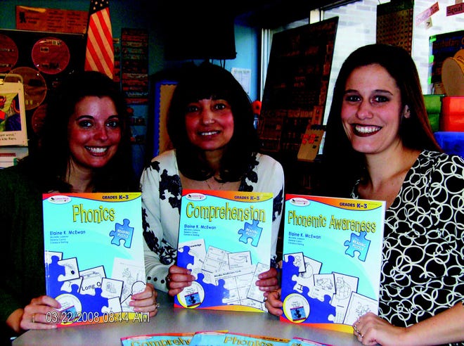 PUBLISHED AUTHORS — Three Barringer Road first-grade teachers have recently become authors with the help of educational consultant Elaine McEwan. They wrote books on Phonics, Comprehension and Phonemic Awareness for use by teachers of grades K-3. Posing with their books, which go on sale soon, are, from left, Michelle Judware, Darlene Carino and Candace Darling.