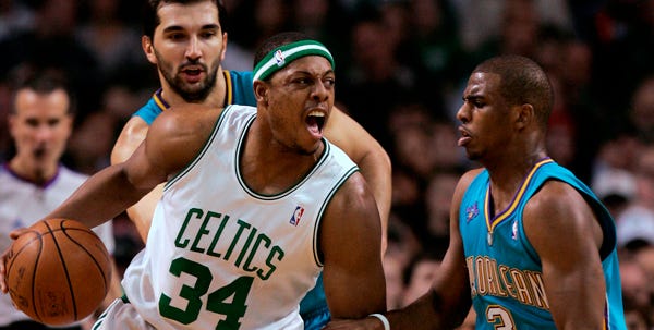 The Celtics' Paul Pierce (34) works against Chris Paul (3) of the New Orleans Hornets during Friday night's 112-92 Celtics victory.
