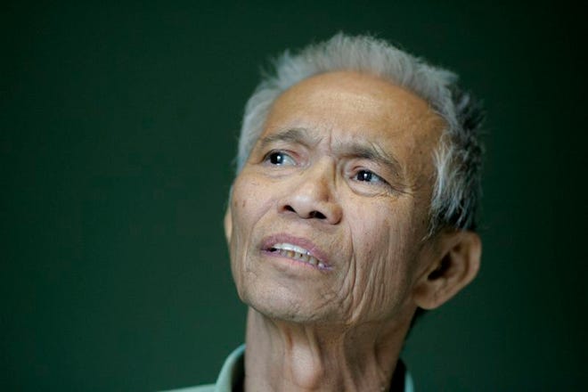Dith Pran relaxes in a hospital room March 14. Dith, the Cambodian-born New York Times journalist whose life inspired the film "The Killing Fields," died today in a New Jersey hospital. He was 65.