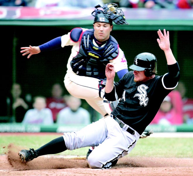 Cleveland catcher Kelly Shoppach tags out Chicago’s Joe Crede during the eighth inning of Monday’s opener.