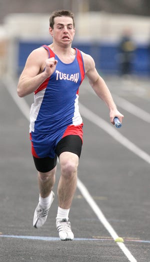 Tuslaw’s Drew Greenfelder competes in the 800-meter relay on Tuesday.