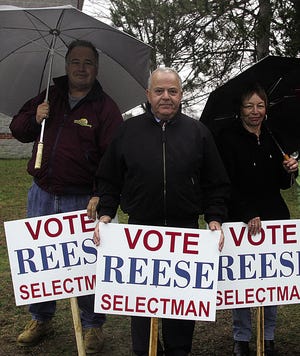 Newly-elected Dighton selectman Ed Reese is flanked on the left by Mike Cambria and Evelyn Rodriguez on the right Tuesday as the trio did some last-minute campaigning.