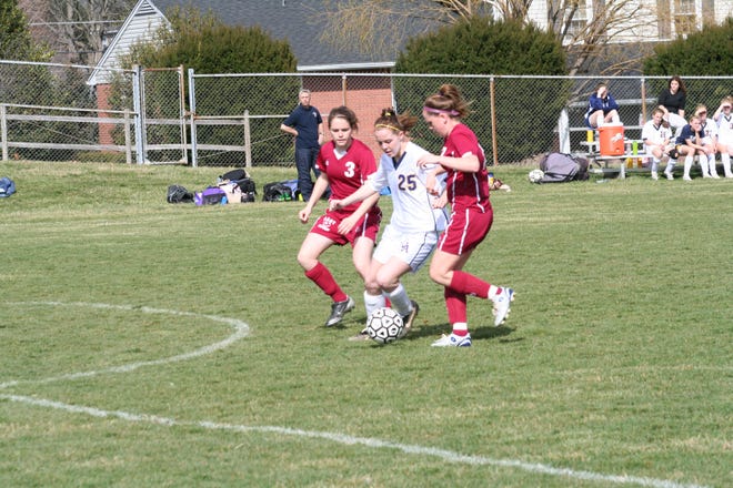 G-A’s Lauren Kelly controls the ball as two Shippensburg players close in during Tuesday’s game.