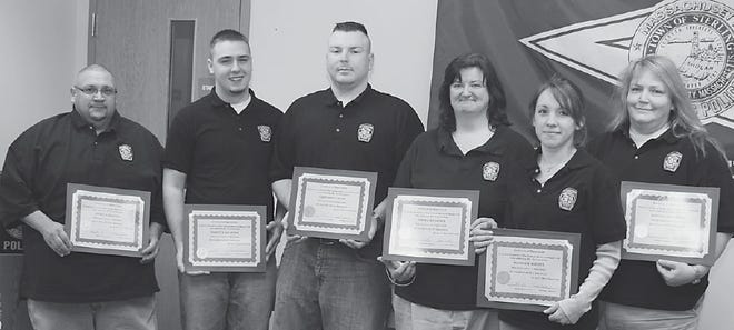WITH APPRECIATION: Sterling dispatchers Maurice Brassard, Garrett MacArthur, Chris Wilder, Debra MacArthur, Beatrice Serewicz and Michelle Braconnier show off their certificates of appreciation given to them by the town last Thursday in honor of National Telecommunicators Week. Joyce Roberts photo
