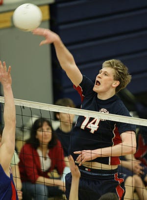 Lincoln-Sudbury middle hitter Lucas Rathjens rips a spike against Brookline.
