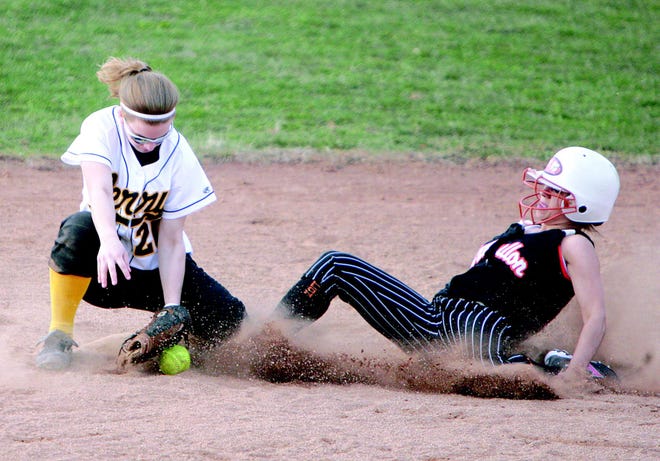 Massillon’s Erikka Wentzel slides into second base as Perry’s Missy Petrovich can’t come up with the throw on Monday.