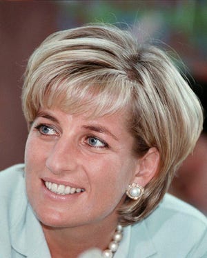 ** FILE ** Diana, the Princess of Wales during her visit to Leicester in this May 27, 1997 file photo, to formally open The Richard Attenborough Centre for Disability and Arts. A coroner's jury in London, Monday April 7, 2008 has ruled that Princess Diana and boyfriend Dodi Fayed were unlawfully killed through the reckless actions of their driver and the paparazzi in 1997. The jury had been told that a verdict of unlawful killing would mean that they believe the reckless behavior of their driver Henri Paul, and photographers amounts to manslaughter. It was the most serious verdict available to them Monday.