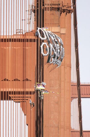 BEN MARGOT/The Associated Press
Protesters climb cables Monday on the Golden Gate Bridge in San Francisco after erecting banners protesting China's human rights record and the impending arrival of the Olympic torch.