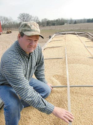 Soybean farmer Andy Welden prepares to make a delivery of a truckloadl of soybeans to JBS United in Jonesville Monday.