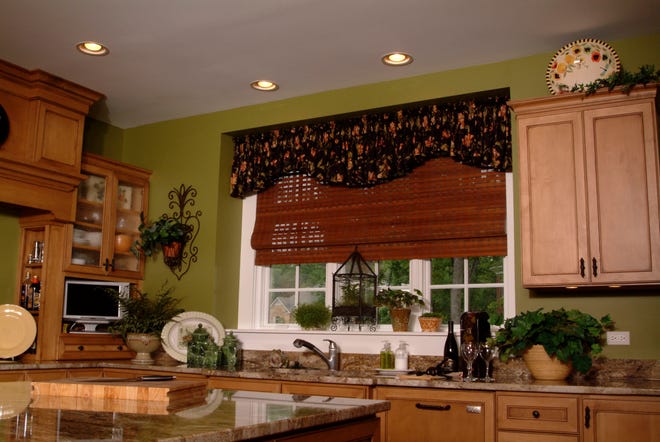 This undated photo provided by Horizons Natural Woven Shades by B&W Window Fashions shows Horizons Natural Woven Shades by B&W Window Fashions in a kitchen. Woven wood shades are hot now, says Sue Sampson, co-author of the "Window Treatments Idea Book." These shades are "an all-natural, green product, so they're getting a lot of attention," she says. Texture, thickness and linings vary, so you can choose one that is partially transparent or one giving total privacy and room darkening when closed.