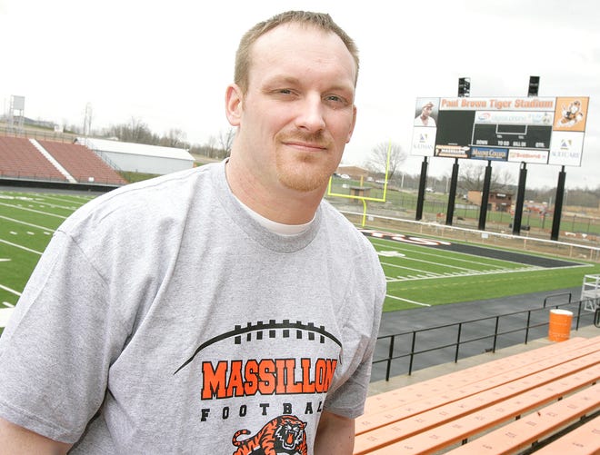 New Massillon head football coach Jason Hall stands inside Paul Brown Tiger Stadium on Friday afternoon, his first full day in his new position.