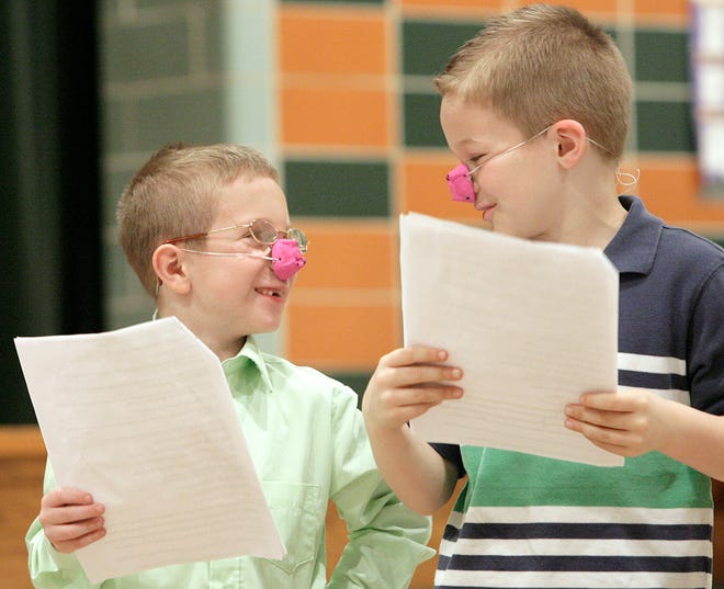 Wearing their pig noses, Gavin Krall and Christopher Davis are prepared to play the roles of two of the three little pigs during Readers Theater at Bowers Elementary School.