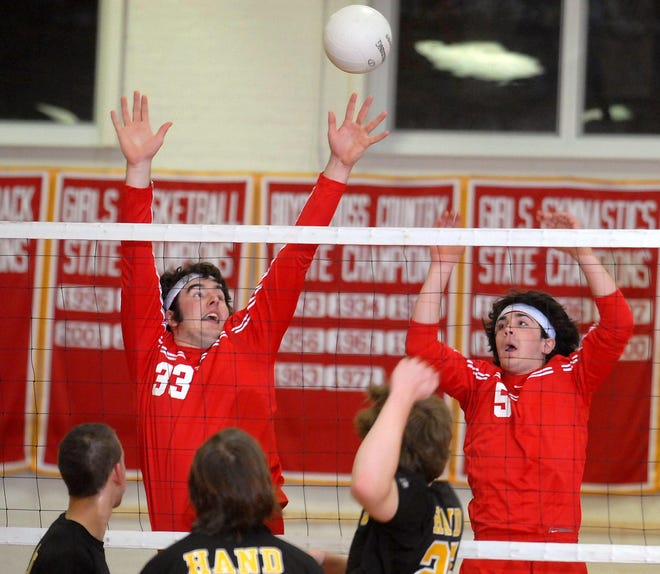 Norwich's AJ Wojtcuk, top left, and Mason Perrone, top right, get ready to send the ball back to Hand's court in a volleyball game at NFA on Friday, April 11, 2008.