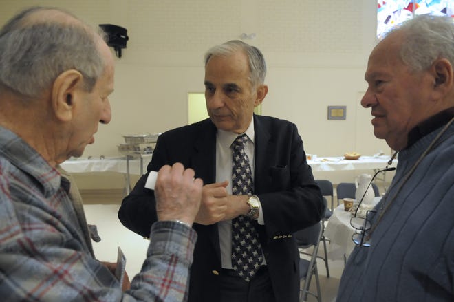 Jewish Community Housing for the Elderly Chairman Paul Rosenberg talks to members of Temple Beth Am after speaking about the Shillman House during a brotherhood breakfast yesterday.